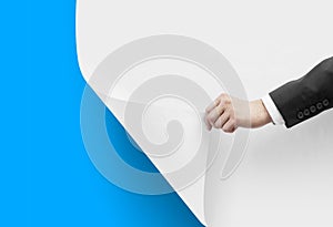 Hand turns white paper