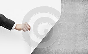 Hand turns white paper