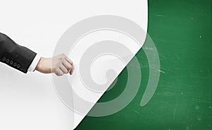 Hand turns white paper