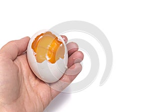 Hand with two yolks egg isolated on white background