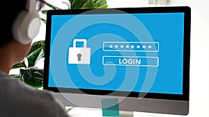 Hand tying computer with password login on screen, cyber security concept