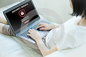 Hand tying laptop computer with password login on screen, cyber security