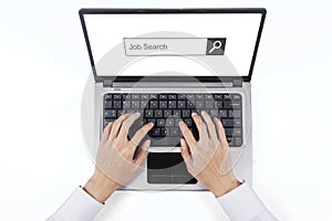 Hand typing job search on the laptop