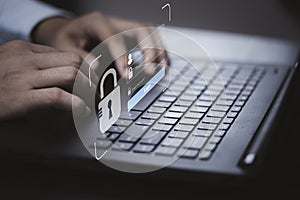 Hand typing on keyboard laptop computer to input username and password for or technology security system and prevent hacker