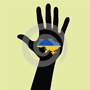 Hand with Ukraine map with the flag inside