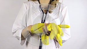 Hand uncover large yellow rubber glove and pick neck stethoscope