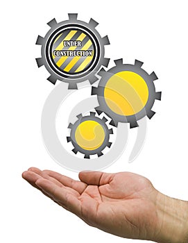 Hand under construction gear white