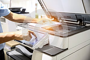 Hand use copier or photocopier or photocopy machine office equipment workplace for scanner or scanning document or printer for