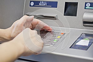 Hand using atm machine