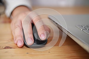 Hand using computer mouse, clicking pointer laptop pc peripheral