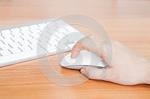 Hand using computer mouse