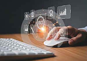 Hand using computer mouse interacting with digital interface data analytics and icons
