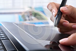 Hand using digital pen tablet