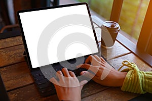 hand using digital tablet showing white screen