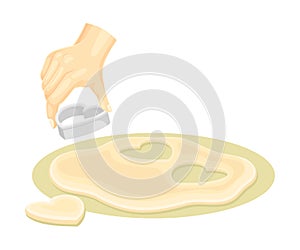 Hand using heart shaped cookie cutter to cut dough. Bakery process, homemade food vector illustration