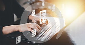 Hand using laptop and touch folder of document Management System, online documentation database and process automation to efficien