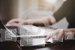 Hand using laptop and touch folder of document Management System, online documentation database and process automation to efficien