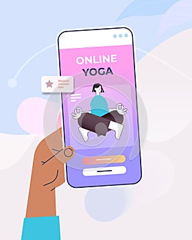 hand using mobile fitness app woman sitting lotus pose on smartphone screen training workout online yoga