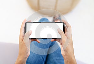 Hand using phone in horizontal white screen display