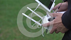 Hand Using Remote Control of Radio Controlled Drone toy Vehicle with the Motor Noise. Close up Shot, Static Camera Sony