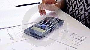 Hand using scientific calculator