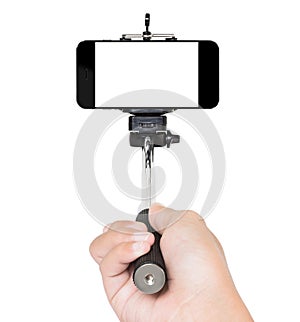 Hand using selfie stick isolated white clipping path inside