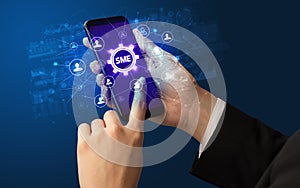 Hand using smartphone with technology concept