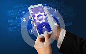 Hand using smartphone with technology concept