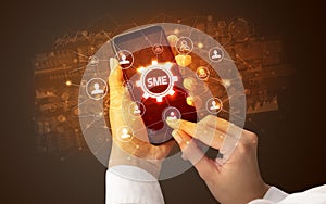 Hand using smartphone with technology concept