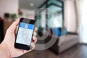 Hand using smartphone to smart home app on mobile.