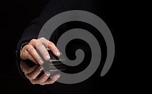 Hand using mouse on dark background