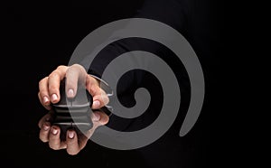 Hand using mouse on dark background