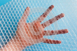 Hand is visible through Bubble Wrap Packing