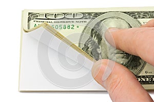 Hand and wad of paper