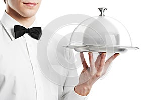 Hand of waiter with cloche lid photo