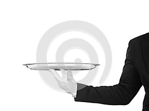 Hand of the waiter in white glove with silver dish