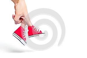 Hand Walking in Red Canvas Shoes