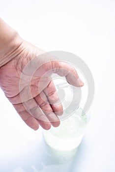 Hand was holding  bottle of hand sanitizer