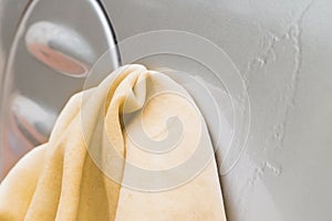 Hand Washing Car with Yellow Chamois microfiber towel