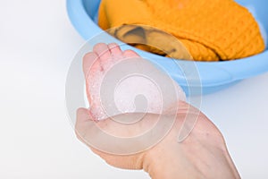 Hand washing of delicate woolen knitted clothes, sweaters concept