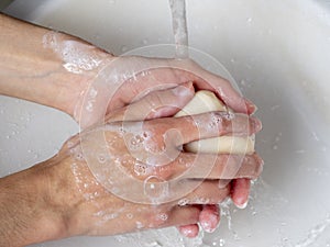 Hand washing with soap. Concept of personal hygiene, countering viruses and microbes