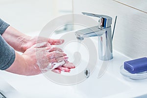 Hand washing with soap.