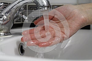 Hand washing. Wash hands under running water