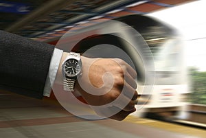 Hand with watch with LRT background