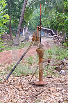 Hand water pump retro style in garden
