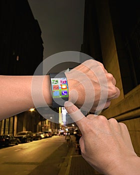 Hand wearing ultra-thin curved-screen smart watch with apps