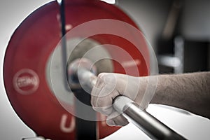 Hand on a Weightlifting Barbell