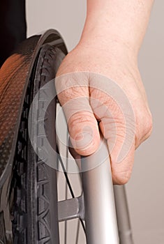 Hand on a wheelchair photo