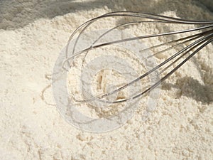 Hand Whisk in flour mixing bowl