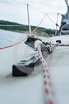 Hand winch on a sailboat while sailing.